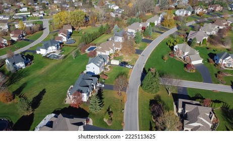 Single Family And Duplex Houses Along Large Residential Street With Grassy Lawn And Colorful Fall Foliage At Suburban Neighborhood In Rochester, New York. Upscale Suburban Home In Subdivision USA