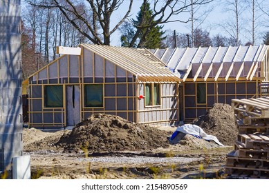 Single Family Home Construction. Interior Frame Of New Wooden House Under Construction. House Under Construction With The Roof Structure Of Wood. Construction Frame House Made Of Wood, With Roof