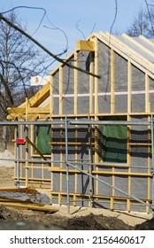 Single Family Home Construction. Interior Frame Of New Wooden House Under Construction. House Under Construction With The Roof Structure Of Wood. Construction Frame House Made Of Wood, With Roof