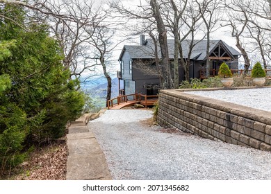 Single Family Mountain Vacation Rental House With Gravel Road Driveway By Landscape View In Fall Autumn At Wintergreen Ski Resort Town City Of Nelson County, Virginia