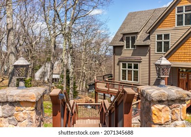 Single Family Mountain Vacation Rental House With Masonry Stone Entrance With Lamps Lights By Wooden Stairs Steprs Boardwalk At Wintergreen Ski Resort Town City Of Nelson County, Virginia