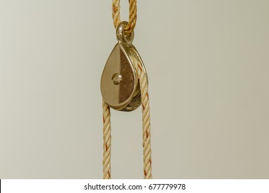 Single fixed pulley on white background