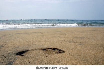 Single Footprint Shot From Low Angle On The Beach