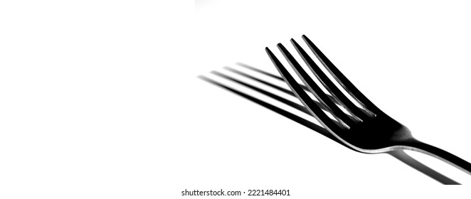 Single Fork Isolated On White Background With Shadow Representing Elegant Dining On Fancy Food