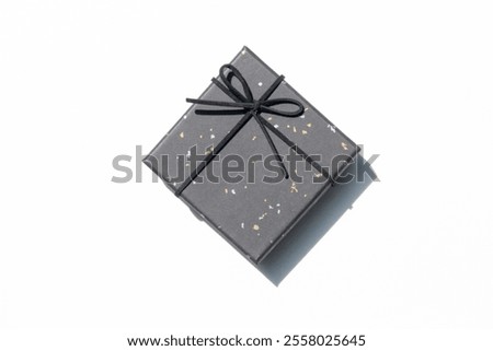 A single gift box isolated on a white background, showcasing simplicity and elegance.