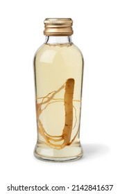 Single Glass Bottle With Ginseng Drink And Ginseng Root Isolated On White Background Close Up