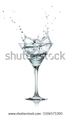 single glass of transparent alcohol drink with great splash isolated on white background