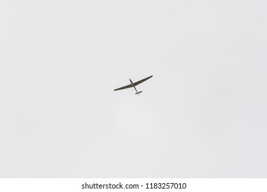 A single glider in the sky without clouds