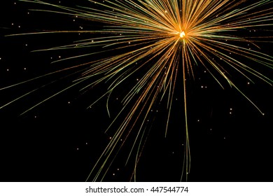 Single Gold And Green Aerial Fireworks Explosion For A July 4th Celebration