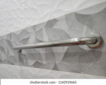 Single Grab Bar On The Tiled Wall. 