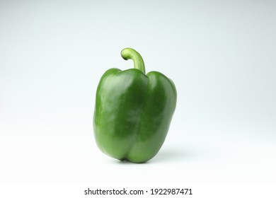 Single green bell pepper isolated on white background with copy space.