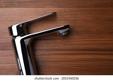 Single Handle Water Tap On Wooden Table, Top View. Space For Text