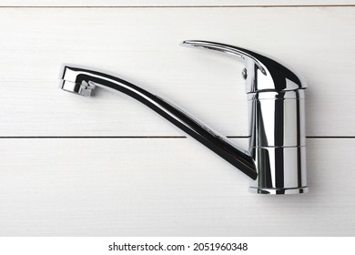 Single Handle Water Tap On White Wooden Table, Top View