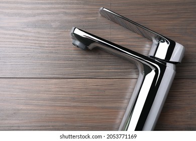 Single Handle Water Tap On Wooden Table, Top View. Space For Text