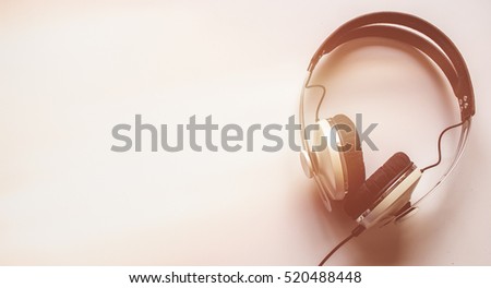Single headphones on a table.