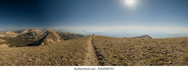 Single HIker On Empty Summit of Mt Holmes in Yellowstone