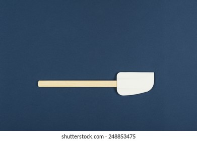 Single Kitchen Spatula Used For Baking And Cooking In The Preparation Of Food On A Blue Background With Copyspace, Overhead View