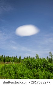 Single lenticularis cloud in front of blue sky