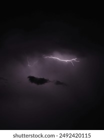 A Single Lightning Bolt Illuminates the Night Sky