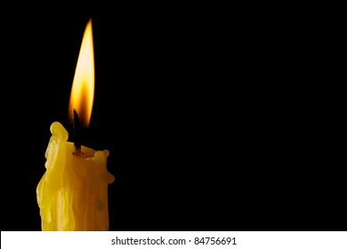 Single Lit Candle With Quite Flam