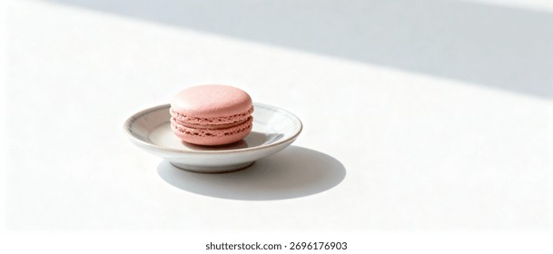 Single macaron centered on small porcelain dish - Powered by Shutterstock - Get 15% off with code: PIKWIZARD15