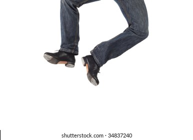 Single Male Tap Dancer Wearing Jeans Showing Various Steps In Studio With White Background.