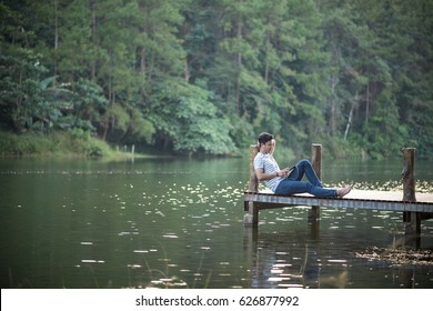 Single Man Listen Music On Dock