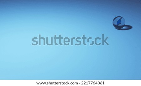 single marble rolling on a bluish plain ground-4
