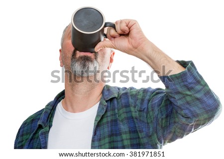 Single middle aged bearded man in flannel and tee shirt gulping down the last drop of coffee from a dark mug over white background