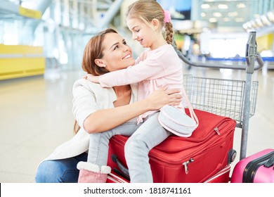 Single Mother And Daughter In The Airport Terminal At The Welcome