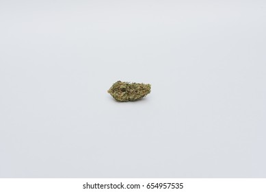 Single Nug Of Marijuana. Weed Nugget On Endless White Background.