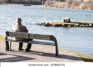 Single Old Man On Sits On A Bench