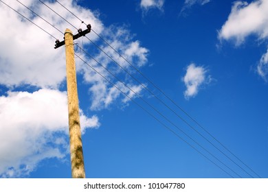 Single Old Telephone Pole Over Cloudy Sky