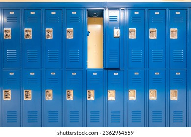 Single open empty blue metal locker along a nondescript hallway in a typical US High School. No identifiable information included and nobody in the hall.	 - Powered by Shutterstock