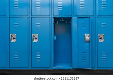 Single open empty blue metal locker along a nondescript hallway in a typical US High School. No identifiable information included and nobody in the hall.	 - Powered by Shutterstock