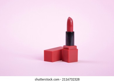 Single Opened Tube Of Satin Finish Red Lipstick, Studio Shot