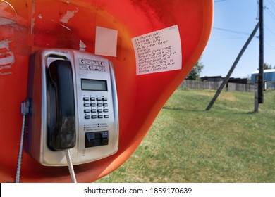 A Single, Outdated Braille Phone Booth Operates In A Distant Village On The Banks Of A Large River.