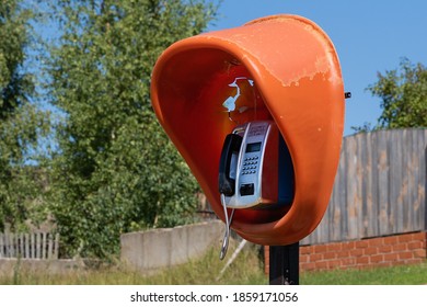 A Single, Outdated Braille Phone Booth Operates In A Distant Village On The Banks Of A Large River.