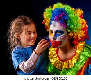 Single Parent Family. Tired Mom After Work As Clown On Birthday On Dark Background. Adult Child Relationship. Social Problem Mad Parent.