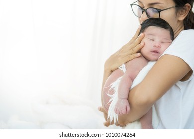 Single parent with newborn baby at home, unplanned pregnancy concept.women not have Available contraceptive methods include use of birth control pills, intrauterine device,Cause social problems