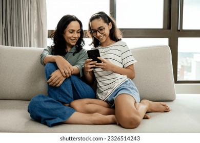 Single parenthood. Mother and daughter spending time together at home. - Powered by Shutterstock