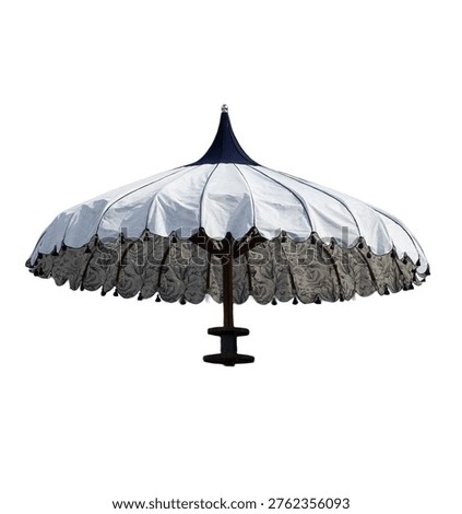 Single patterned sun umbrella isolated on a white background with a soft shadow