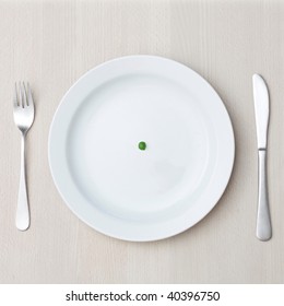 A Single Pea On A Plate