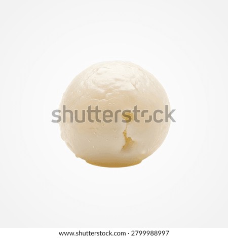 Single peeled lychee fruit with translucent flesh and a slight indentation on white background