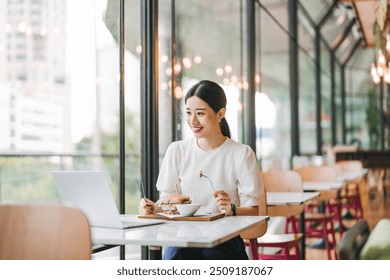 Single people relax city lifestyle concept. Adult asian woman healthy eating breakfast sandwich food diet meal. At indoors cafe restaurant on day. Happy smile face. - Powered by Shutterstock