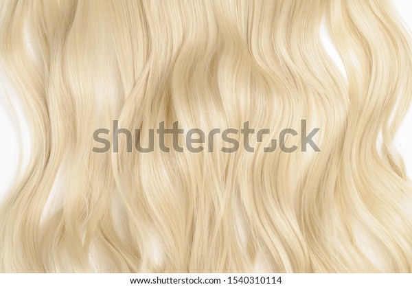 Single piece clip in platinum blonde wavy\
synthetic hair\
extensions