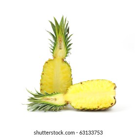 Single pineapple that has been sliced in half on a white background.