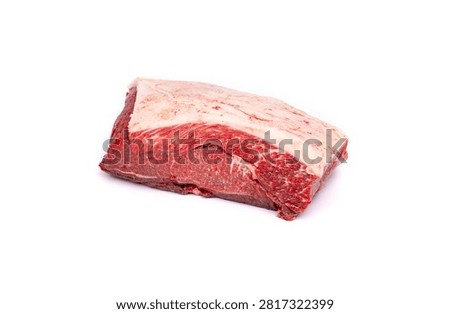 A single raw beef steak with visible marbling rests on a plain white surface.