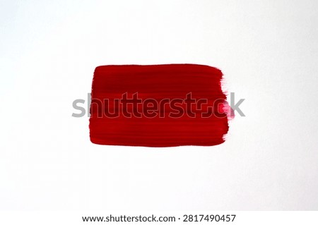 Single Red Brush Stroke Paint Mark on White Background