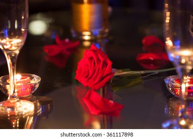 Single Red Rose On A Table